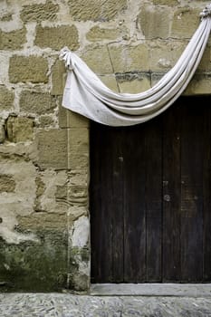 Old medieval wooden door with lock, detail of decoration and protection, antiquity