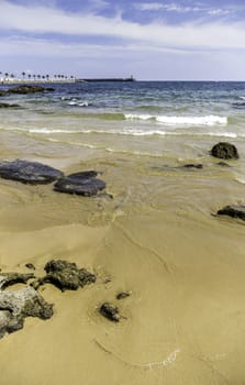 Sandy beach with stones, detail Sea and summer holiday