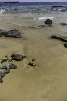 Sandy beach with stones, detail Sea and summer holiday