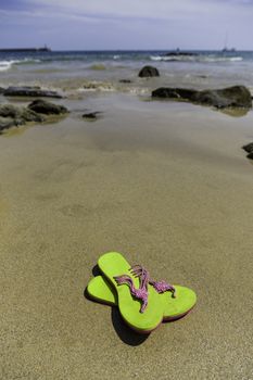 Flip-flops on the beach, summer vacation and detail