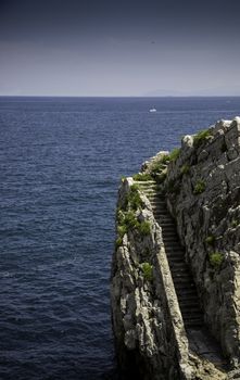 Stone stairs in the sea, detail of old water access