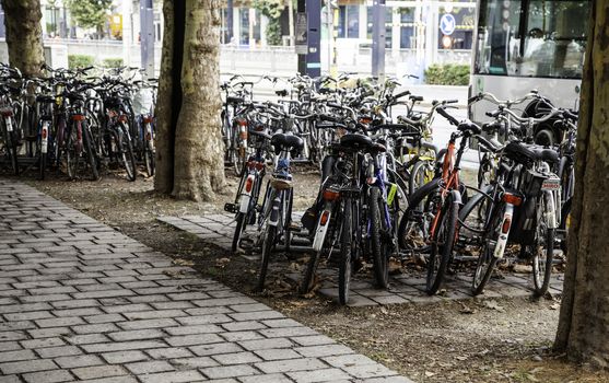 Typical bicycles parked in Holland, transport detail in the city, tourism in europe