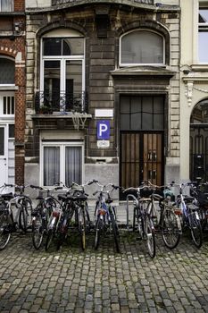 Typical bicycles parked in Holland, transport detail in the city, tourism in europe