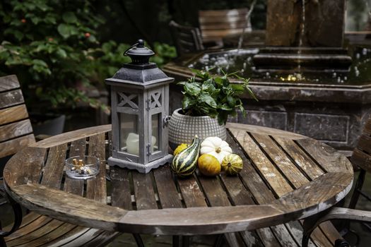 Garden table with pumpkins, decorated terrace detail of halloween