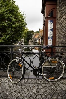 Typical bicycle in Bruges, detail of transport in town, tourism and exploration of the city