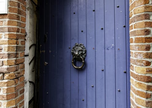Old wooden door with metal, medieval door detail, decoration and security