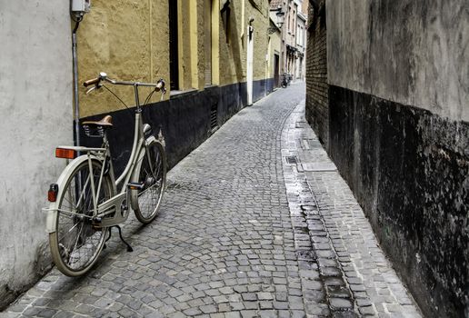 Typical bicycle in Bruges, detail of transport in town, tourism and exploration of the city