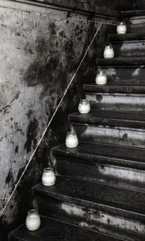 Candles on a staircase, detail of lighting and decoration