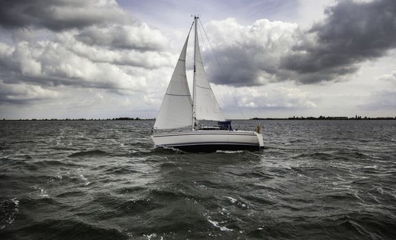 Sailing boat sailing, detail of transport by water