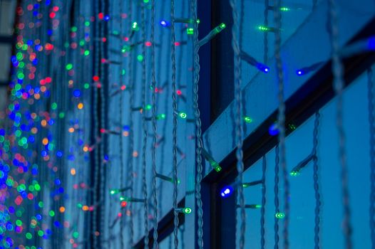 Festive decoration of office buildings, lights electric garland with lights.