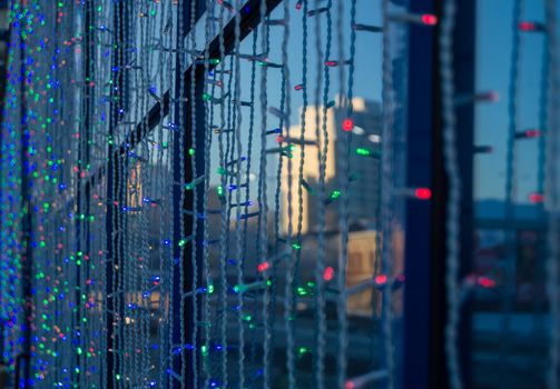 Festive decoration of office buildings, lights electric garland with lights.