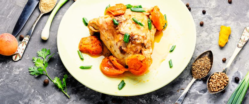 Chicken stewed in apricot sauce. Summer meat dish