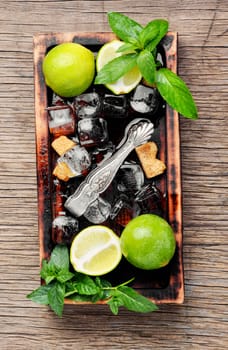 Mojito ingredients. Lime, mint and cane sugar