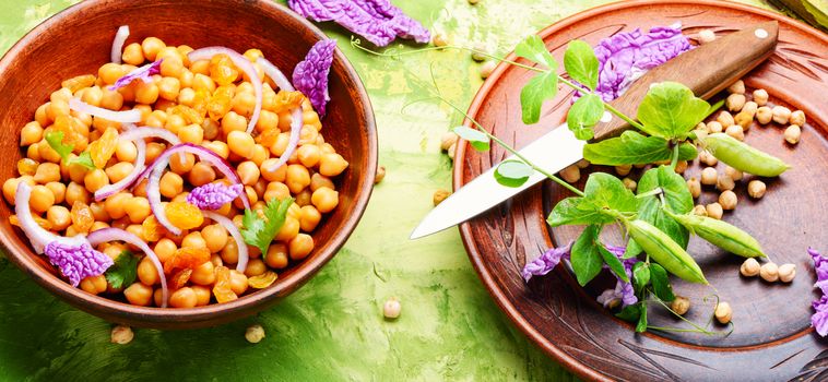 Vegan healthy salad with chickpeas and raisins