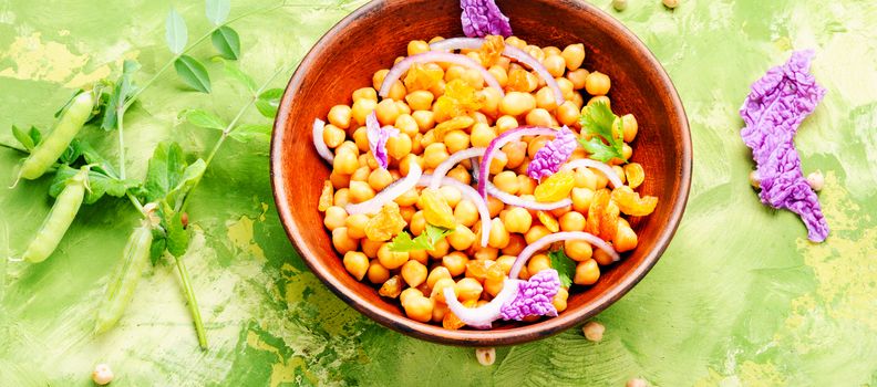 Vegan healthy salad with chickpeas and raisins