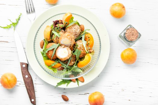 Summer salad with apricot, egg and greens