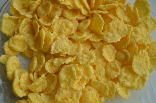 background - crisp corn flakes, close-up healthy eating.