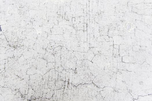 Cracked cement wall, detail of an old wall, ruin and abandonment