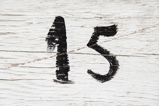Number fifteen painted detail of an odd number of information