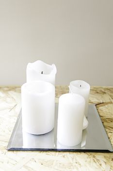 White wax candles, detail of an object to light, flame