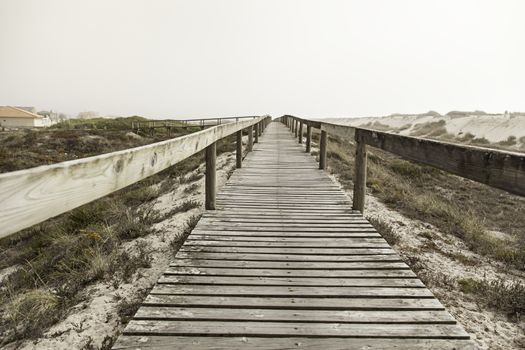 Wooden walkway to the beach, walk detail for people, summer and heat