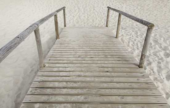 Wooden walkway to the beach, walk detail for people, summer and heat