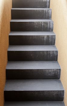 Black stone staircase, detail of a staircase, pedestrians