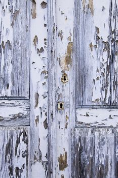 Old decorated door in blue, detail of urban decoration, protection