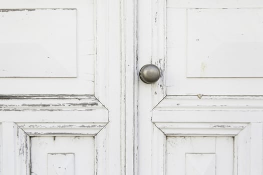 Old white door, detail of a closed door