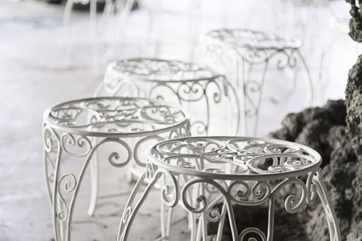 Terrace of a bar on the street, detail of a few tables and chairs
