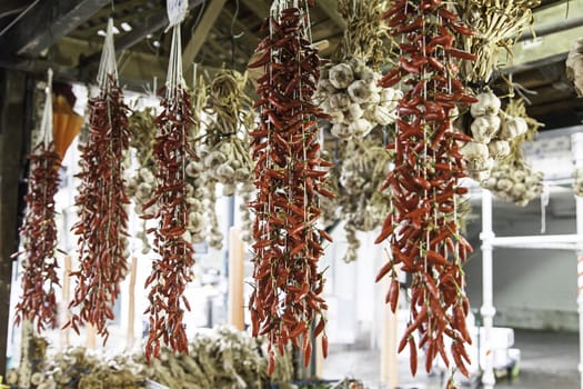 Peppers and garlic in greengrocers, market and sale