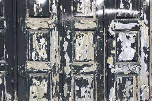 Gaunt black door in urban building, construction