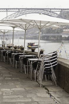 Terrace of a bar on the street, detail of a few tables and chairs
