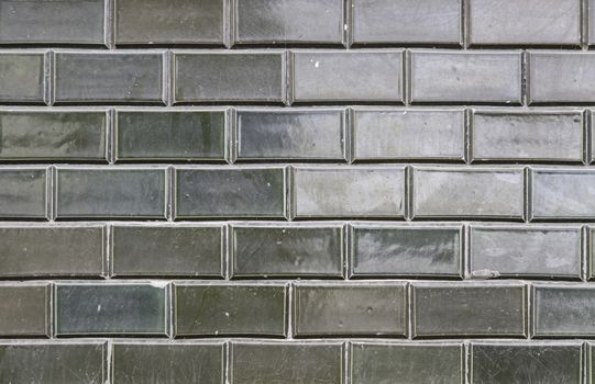Black tile wall urban street, construction