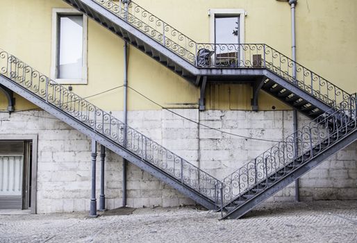 Black stone staircase, detail of a staircase, pedestrians