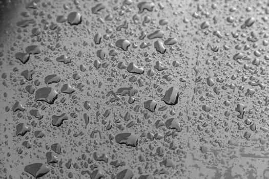 Rain drops, detail of a wet blue background, cold and texture
