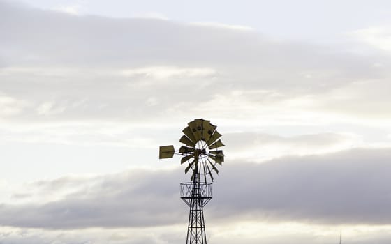 Old metal windmill, detail of wind energy, conservation of the environment