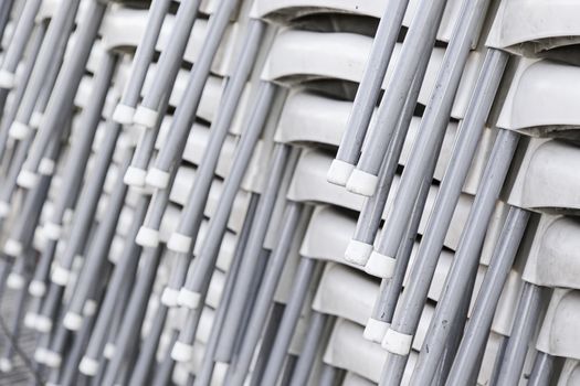 Chairs stacked in the street, detail of a warehouse
