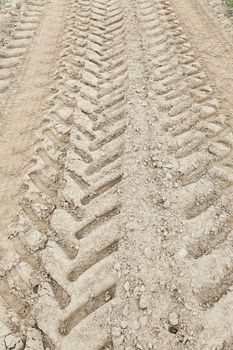 Traces of wheels in the mud, detail of marks in the nature