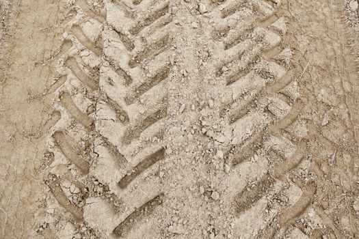 Traces of wheels in the mud, detail of marks in the nature