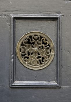 Old door peephole, detail from a viewpoint to the outside
