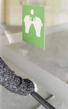 Opening a door, detail of a woman opening a door, access