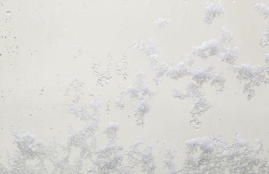 Snow on a glass, detail of snow in the winter, cold and ice