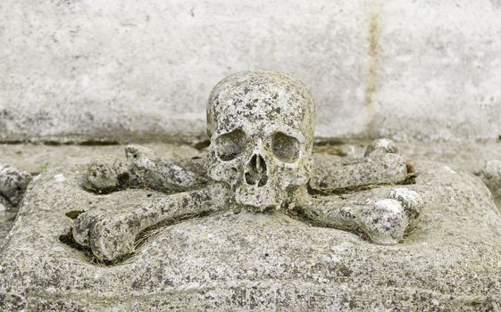 Stone skull, detail of an ancient cemetery, death