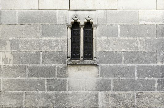 Medieval stone window, detail of a stone wall