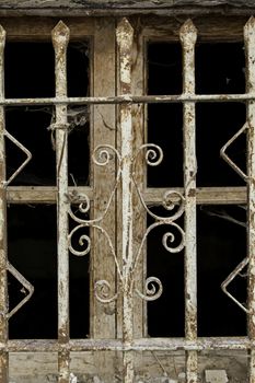 Metal fence, old window, detail of a protection fence