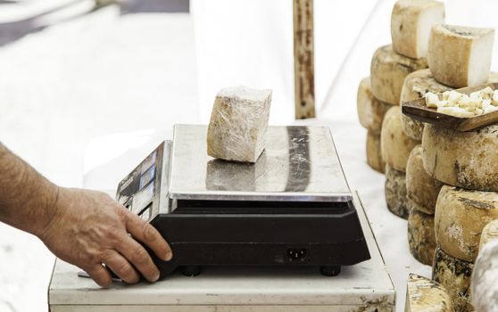Artisan cheese in a market, detail of food, food and tradition, dairy product