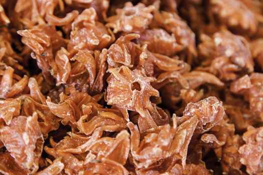 Dry edible hibiscus flower, caramelized flower detail, healthy food