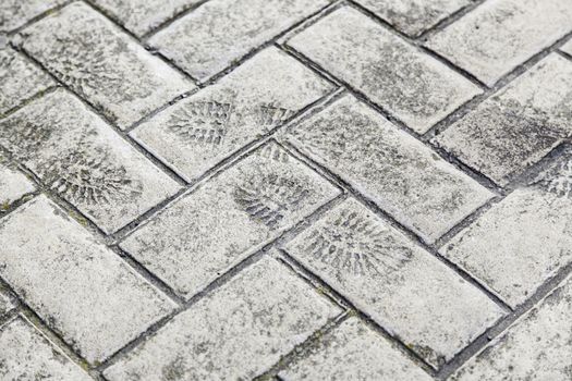 Footprint on cement, detail of a shoeprint, sign
