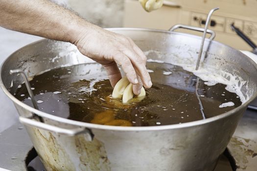 Fried donuts, detail of a traditional market, homemade confectionery